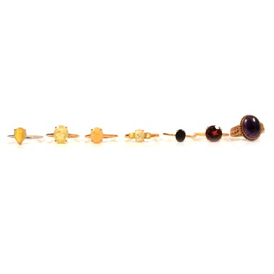 Lot 56 - Seven gemset gold rings, Ethiopian opal and others.