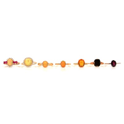 Lot 54 - Seven gemset gold rings, Ethiopian opal and others.
