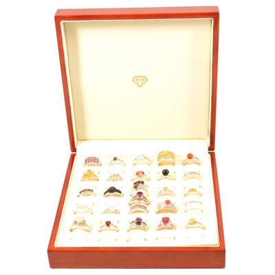 Lot 396 - Twenty-seven gemset silver rings, garnet, opal, topaz, umbalite and others.