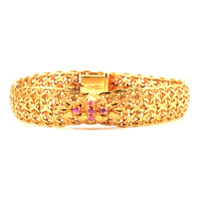 Lot 249 - A yellow metal bracelet set with five rubies.