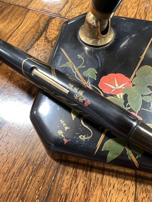 Lot 62 - Dunhill Namiki fountain pen on square form desk stand, with paperwork