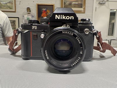 Lot 243 - Nikon F3 camera, various lenses, filters and accessories.