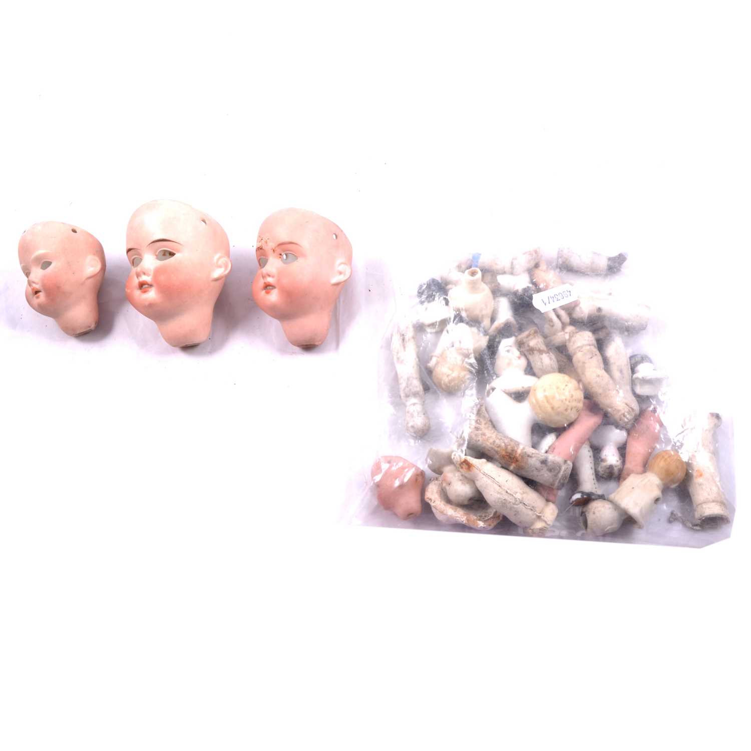 Lot 237 - Collection of bisque dolls' heads, arms, legs and eyes.