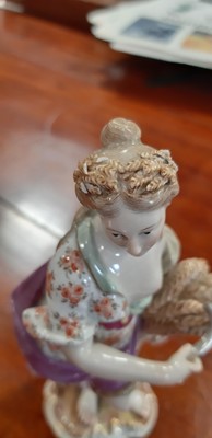 Lot 149 - Three Meissen figures, Grape Picker Boy, two allegorical figures of The Seasons.