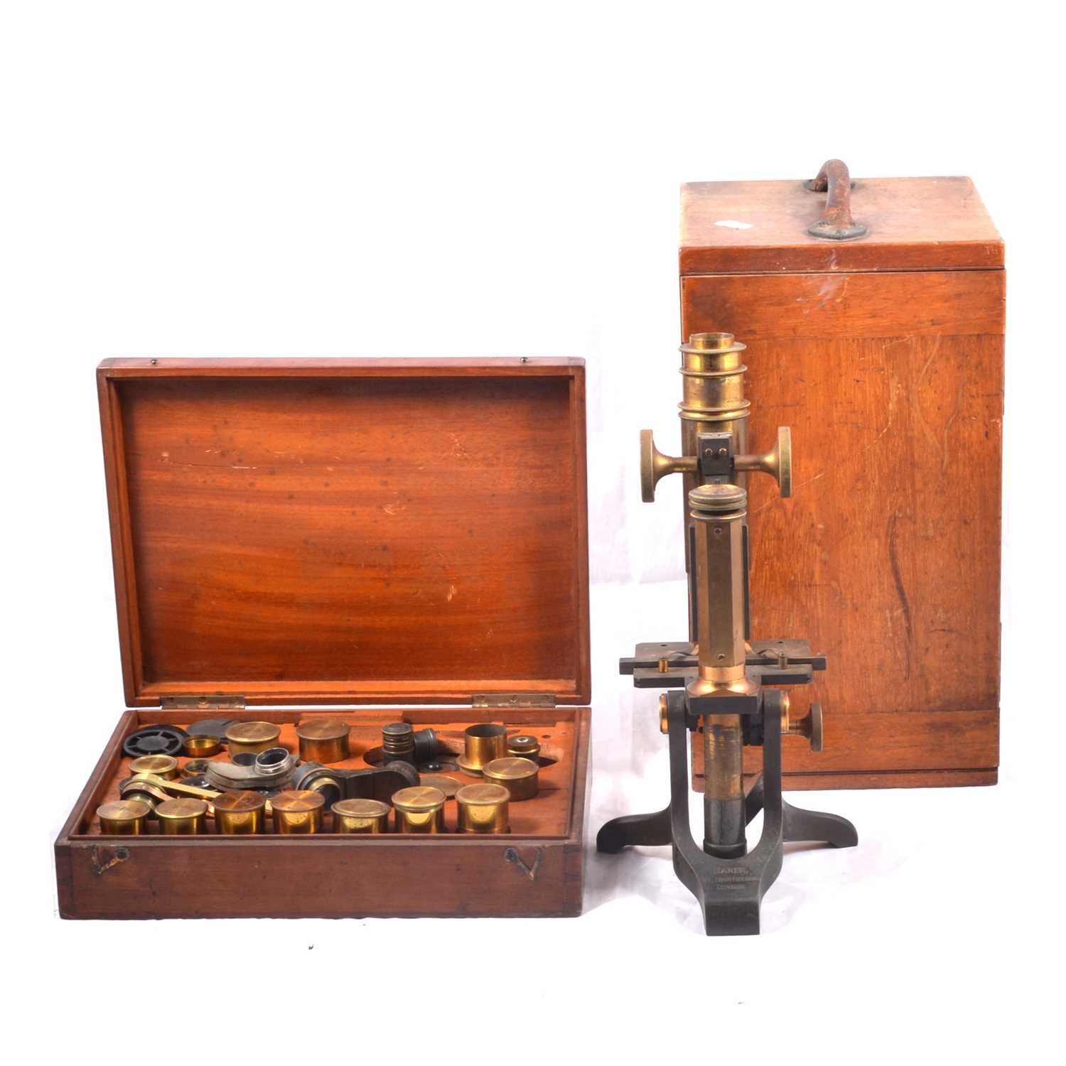 Lot 220 - Baker Brass microscope and various objectives.