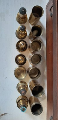 Lot 220 - Baker Brass microscope and various objectives.