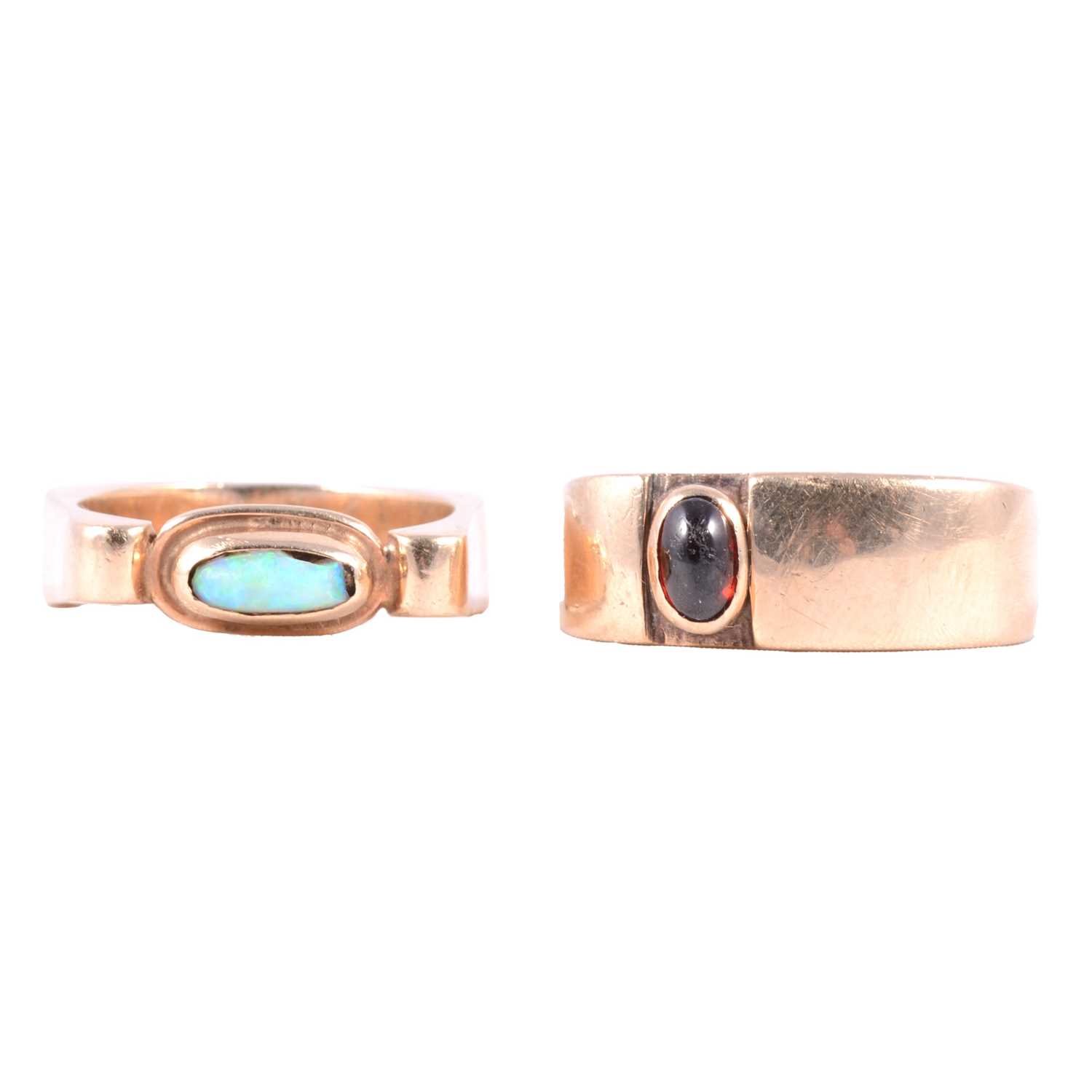 Lot 39 - Two 9 carat yellow gold dress rings, opal (damaged) and garnet.